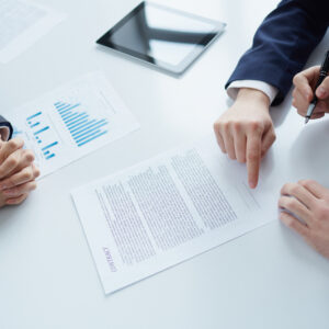 top-view-businessman-signing-documents